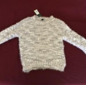 Light grey fuzzy sweater.